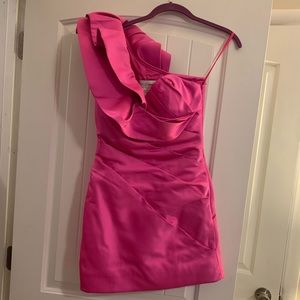Very fun one shoulder elaborate ruffle detail in a vibrant pink satin worn once.